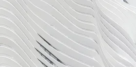 Undulating white balcony plates on a residential tower