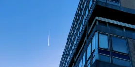A tower corner rising into clear sky